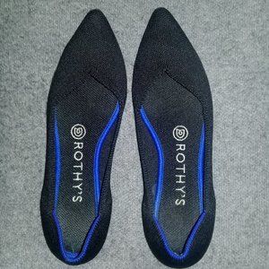 rothy's pointed toe black flats with navy blue accent